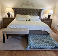 Cluttered bedroom with separate bench and dog bed